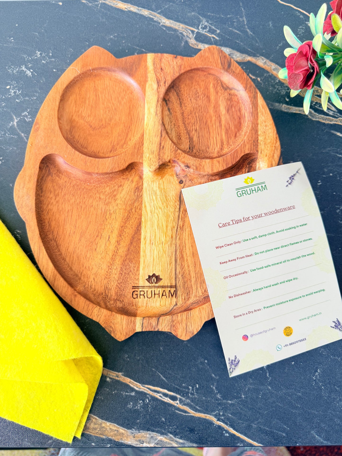 Owl-shaped wooden platter by GRUHAM used for serving snacks and dry fruits during gatherings