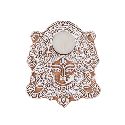 Decorative wall art with a face design on a white background