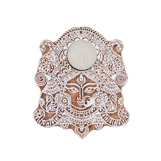 Decorative wall art with a face design on a white background