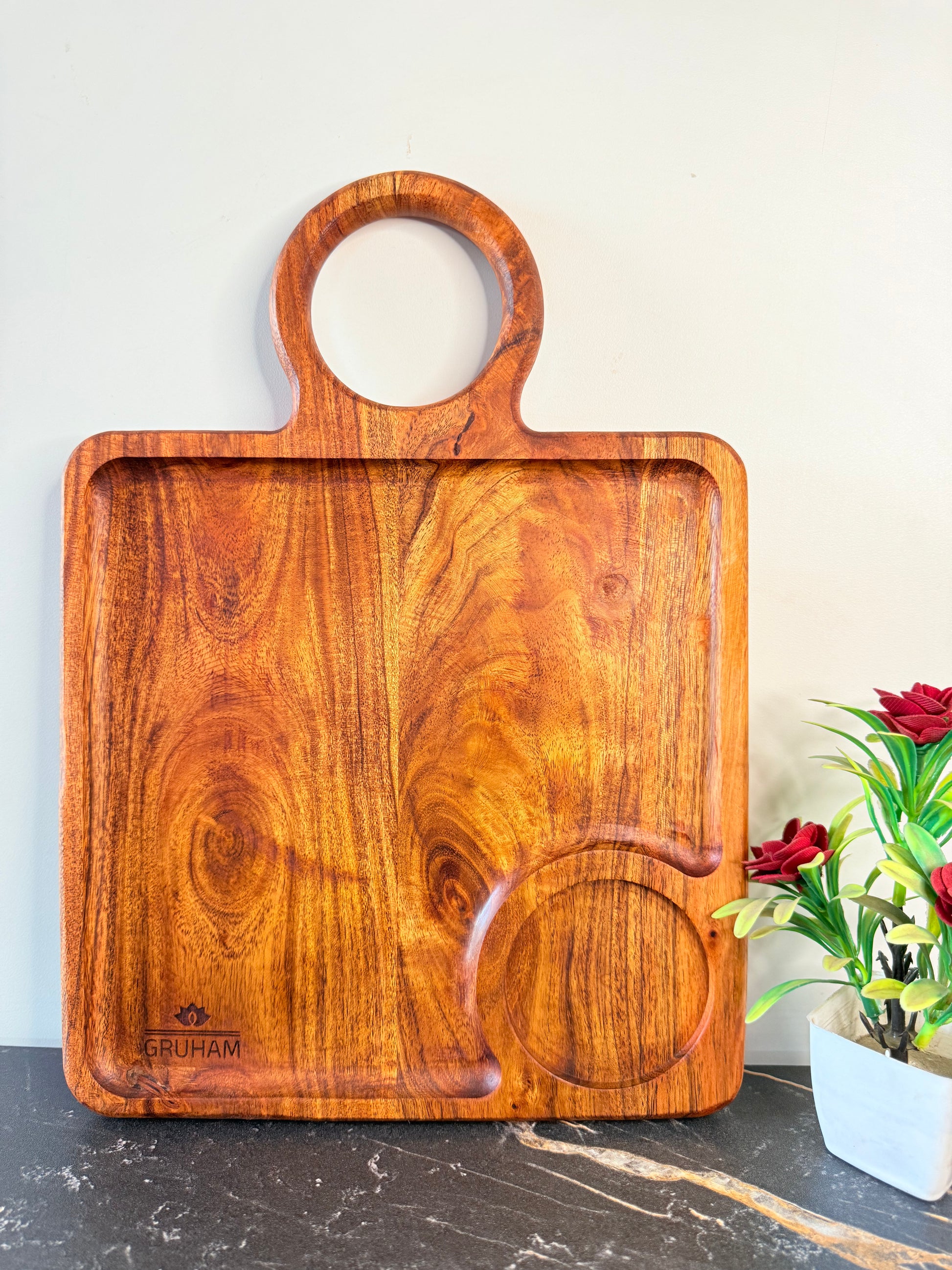 GRUHAM Square Platter displayed on rustic dining table with decorative elements - Eco-friendly wooden decor piece