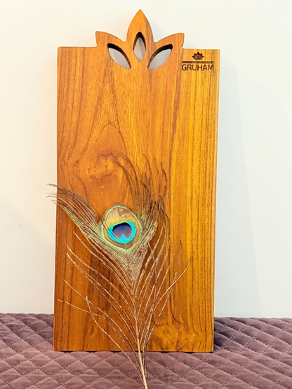 Handcrafted teakwood board with symbolic lotus design, made for cutting and serving