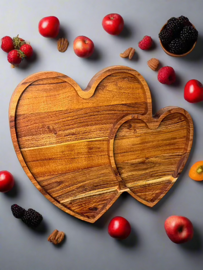 Heart-shaped wooden serving board styled with fruits, desserts, or snacks