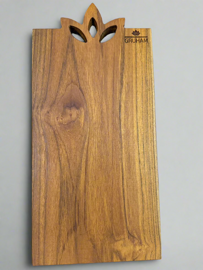 Lotus-inspired wooden handle carved into single-piece GRUHAM teak cutting board