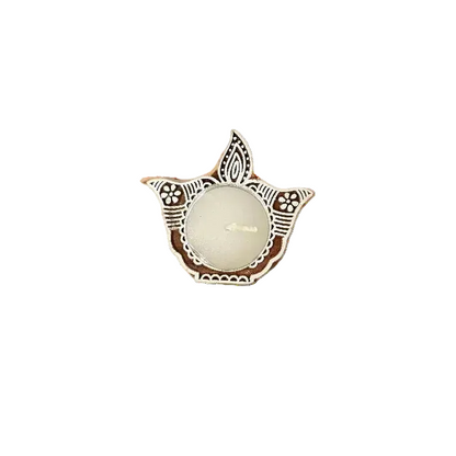 Decorative candle holder with intricate design on a white background