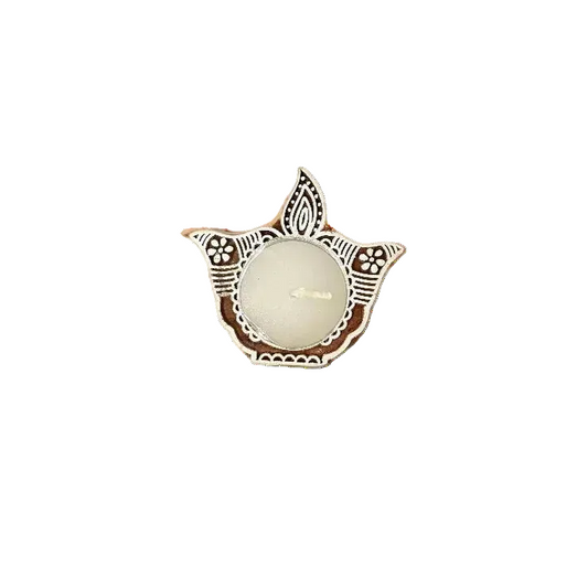 Decorative candle holder with intricate design on a white background